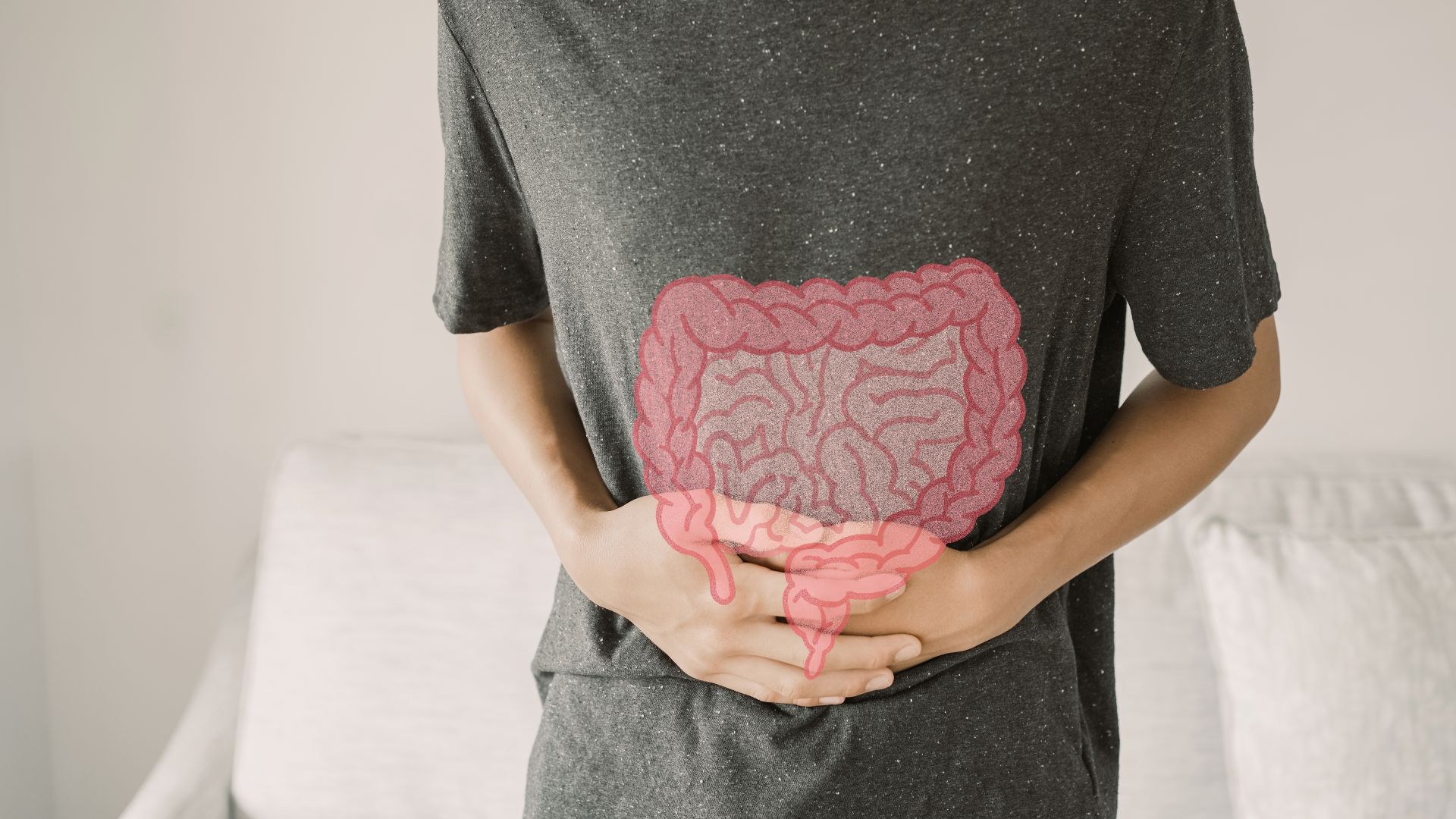 Person hält sich den Bauch